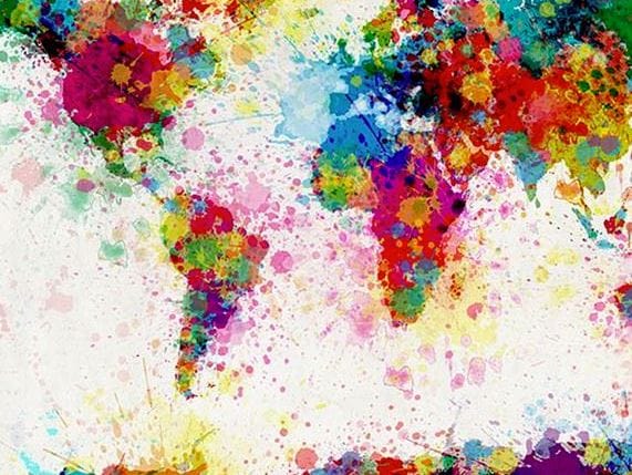 Mapa mundial ilustrado con manchas de pintura de colores, representando la globalización del comercio entre países.